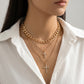 Celeste Layered Cross Necklace on model