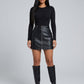 Dafne Faux Leather Mini Skirt on model