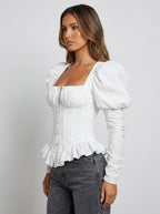 Iride Corset Peplum Puff-Sleeve Top on model