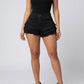 Mara High-Waist Frayed Denim Shorts on model