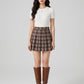 Mirabella Pleated Plaid Skirt on model
